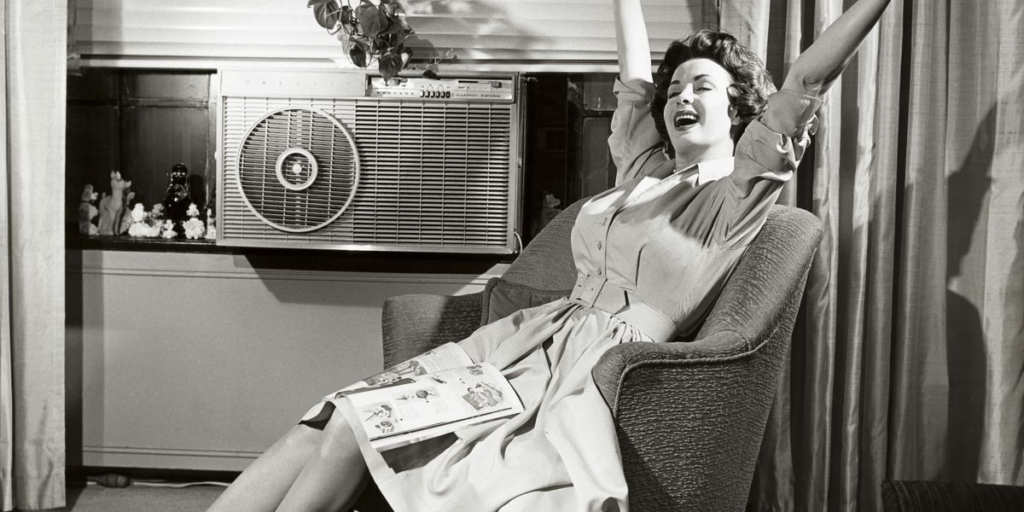 Young woman enjoying her AC.